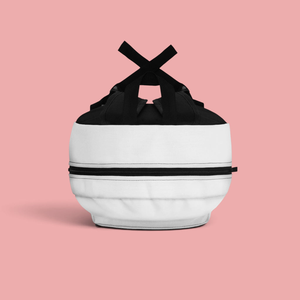 Sovereign Soul .Store white and black everyday backpack with a top-down view on a soft pink background.