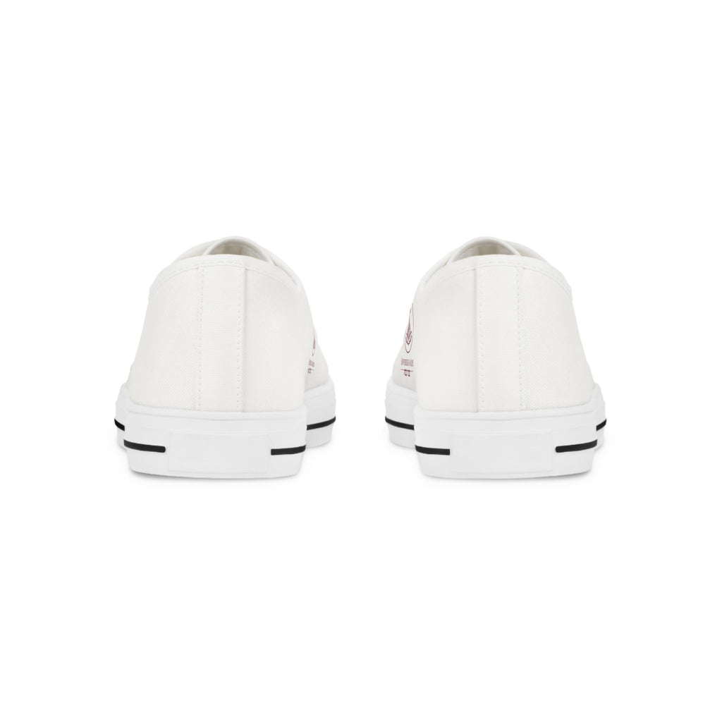 Sovereign Soul .Store white canvas low-top sneakers viewed from the back, featuring durable rubber outsoles.