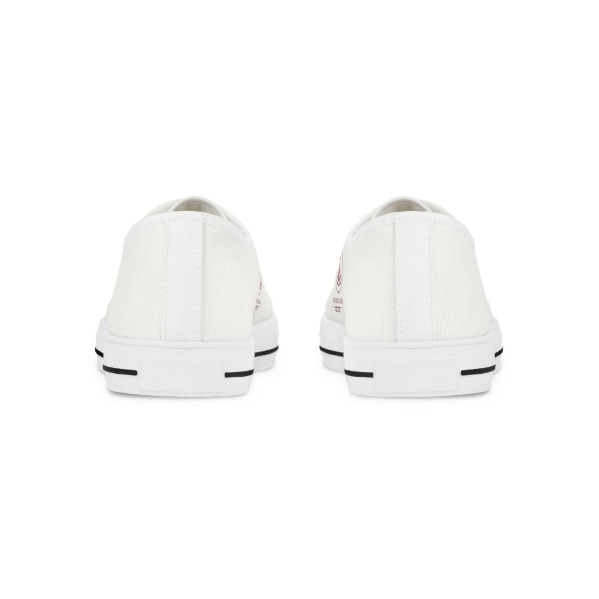 Sovereign Soul .Store white canvas low-top sneakers viewed from the back, featuring durable rubber outsoles.