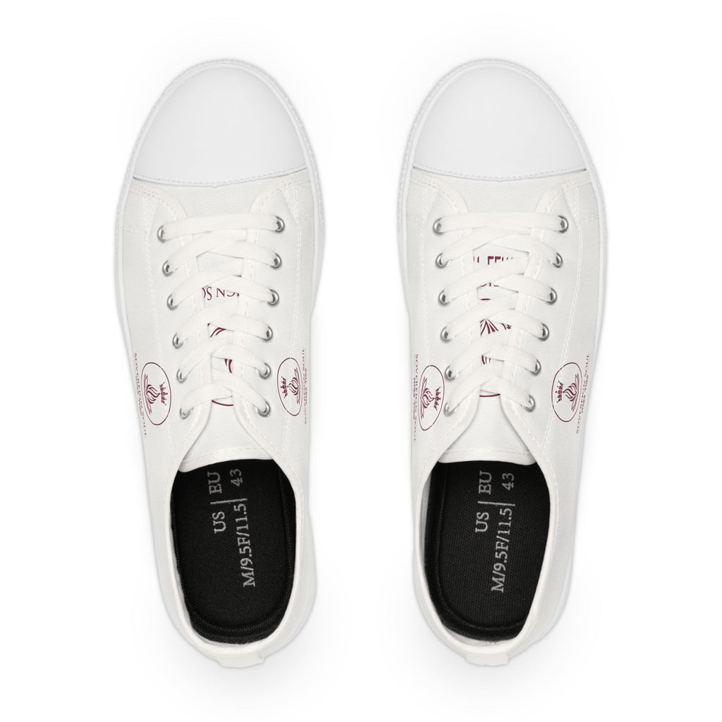 Sovereign Soul .Store white canvas low-top sneakers with silver eyelets and a small red emblem, top-down view.
