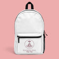 Sovereign Soul .Store white everyday backpack with a lotus and crown emblem and Hebrew text on a pink background